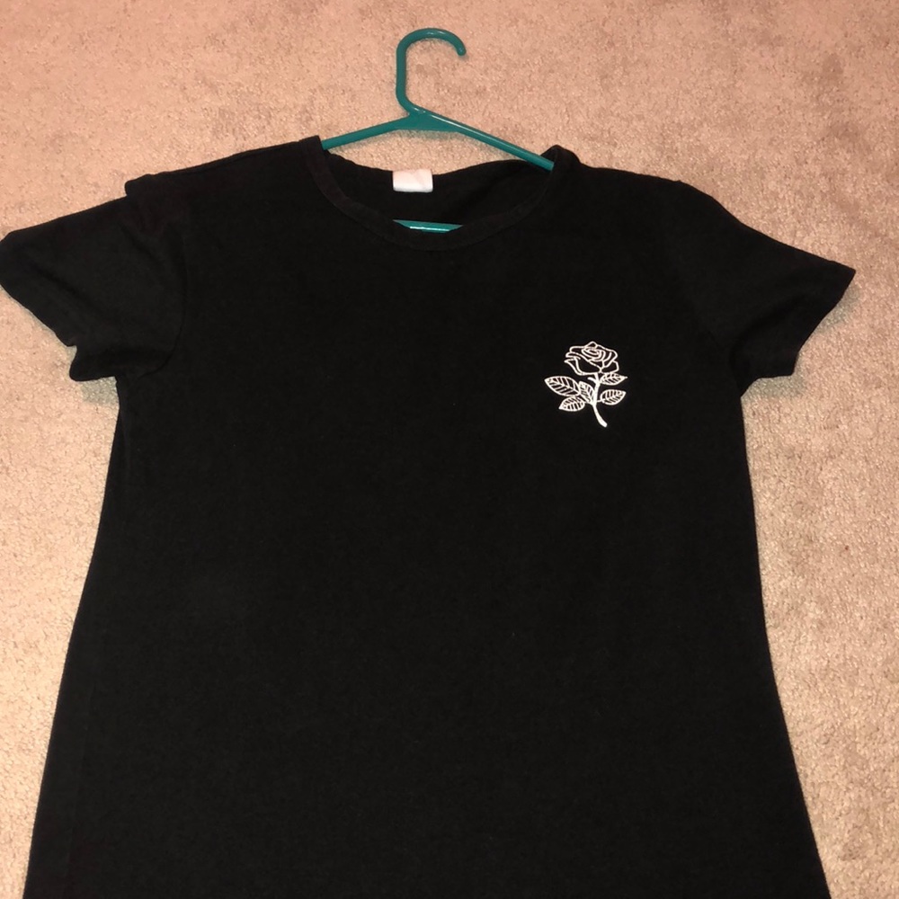 Black shirt with a rose on left side